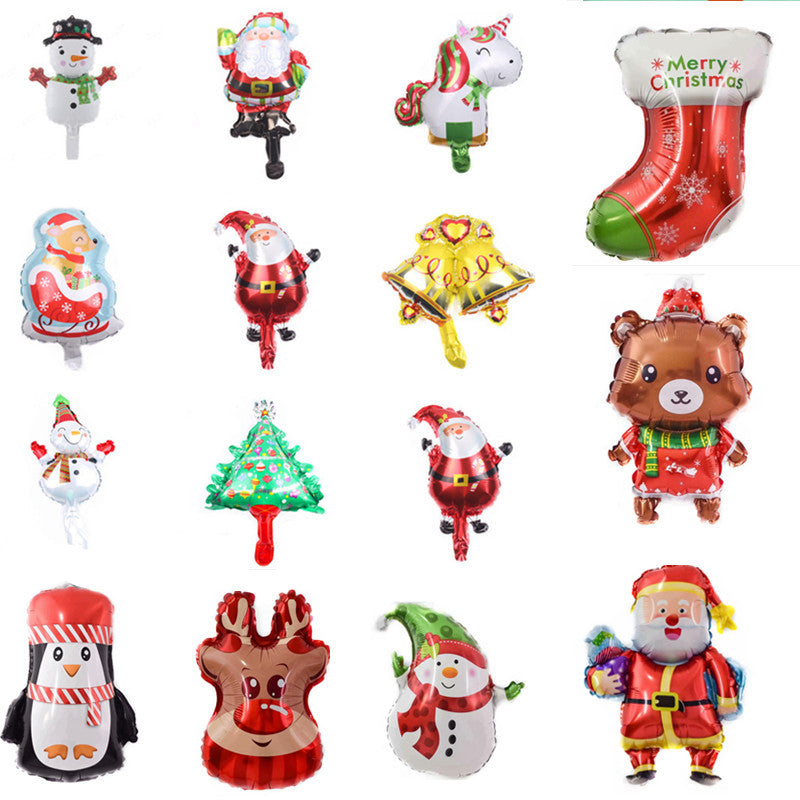 A collection of colorful Christmas-themed balloons, including Santa, snowmen, reindeer, a bear, a penguin, a stocking, a Christmas tree, and a unicorn, arranged in four rows.