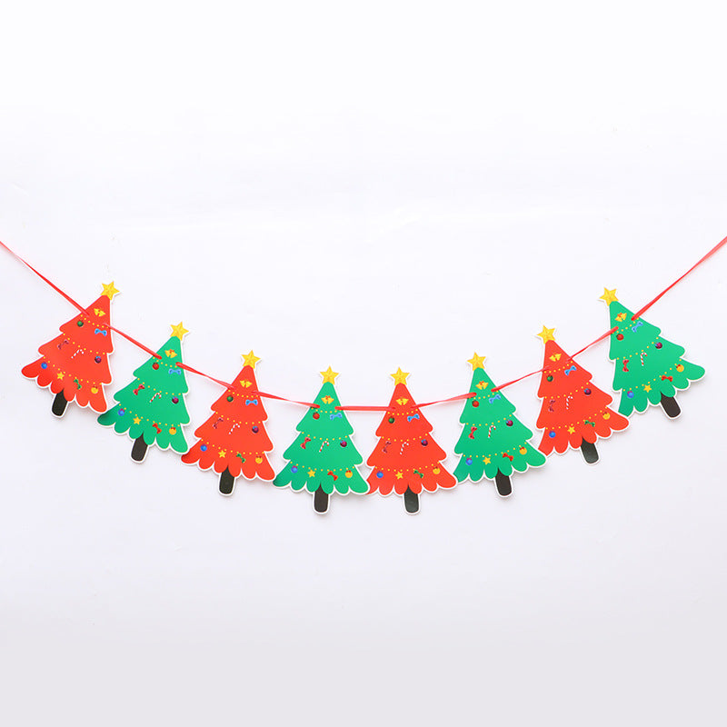 String of paper Christmas tree decorations in red and green, decorated with stars and dots, hanging on a red cord against a white background.