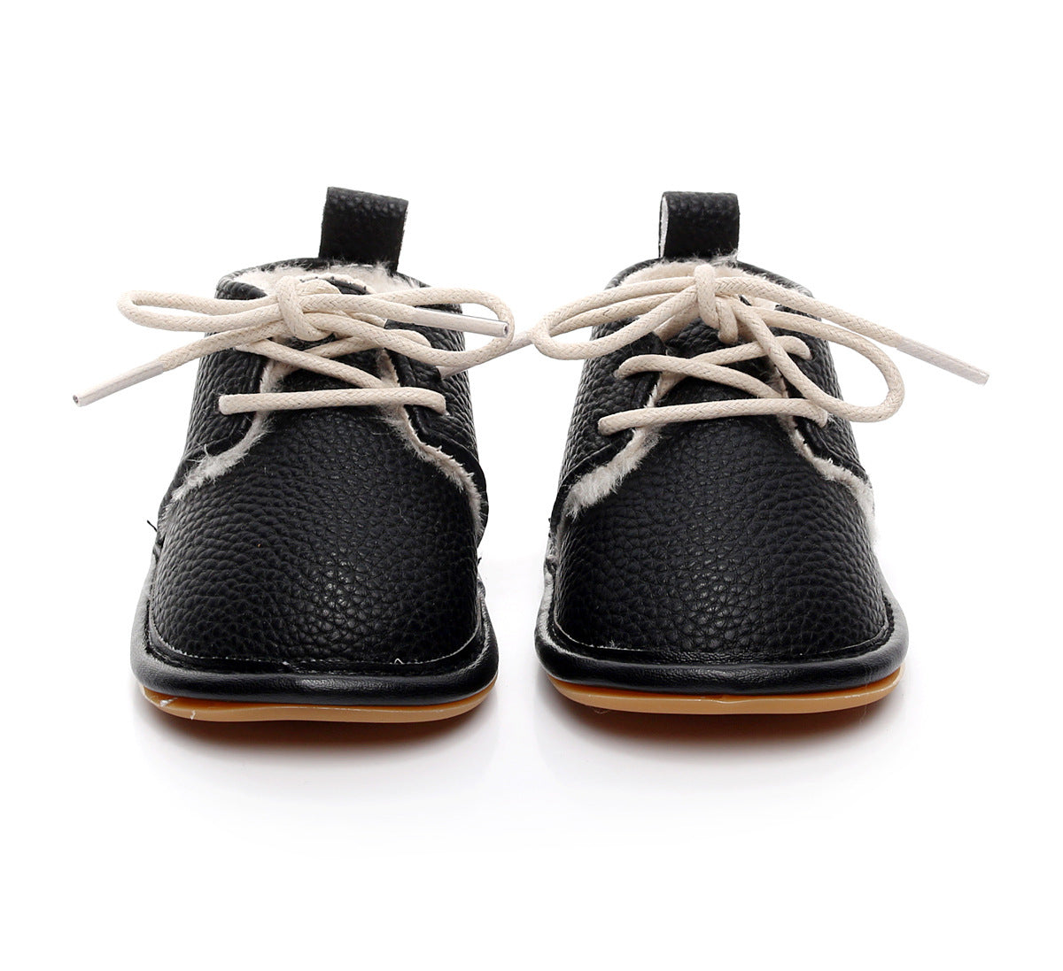 Black toddler shoes with white laces, a textured surface, and beige inner lining. The shoes are displayed against a white background, showing their front view.