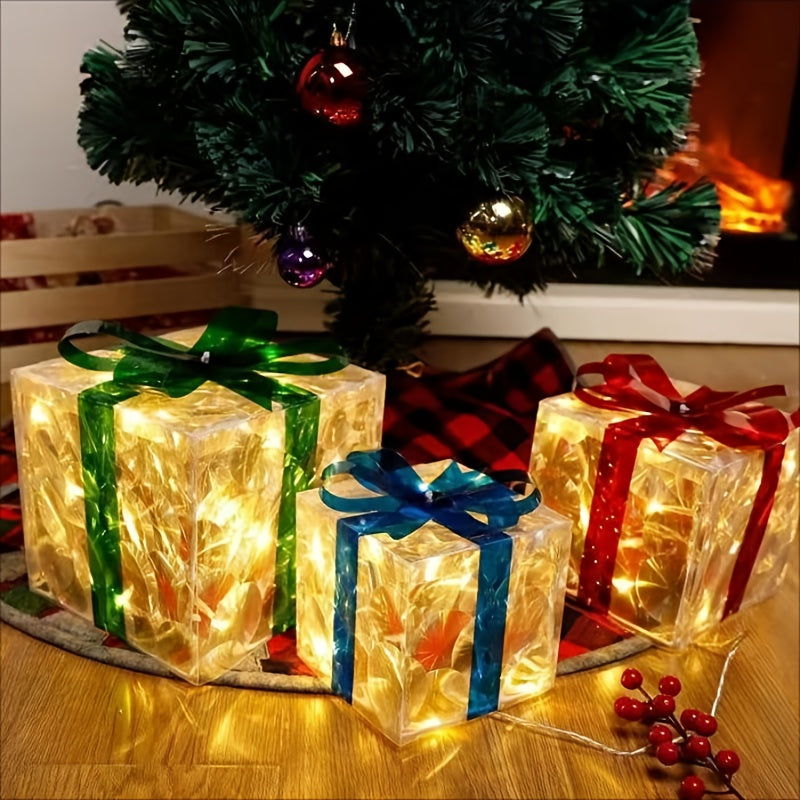 Lit decorative gift boxes with green, blue, and red ribbons sit under a Christmas tree adorned with colorful ornaments. A cozy fireplace glows in the background.