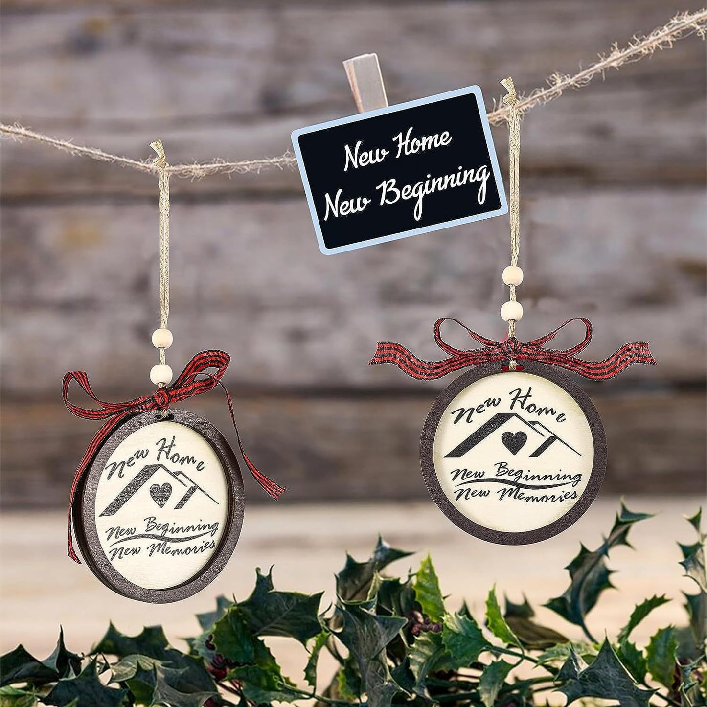 Two hanging ornaments with ribbons, each featuring the words "New Home, New Beginning, New Memories." Above them is a small sign that says "New Home, New Beginning."
