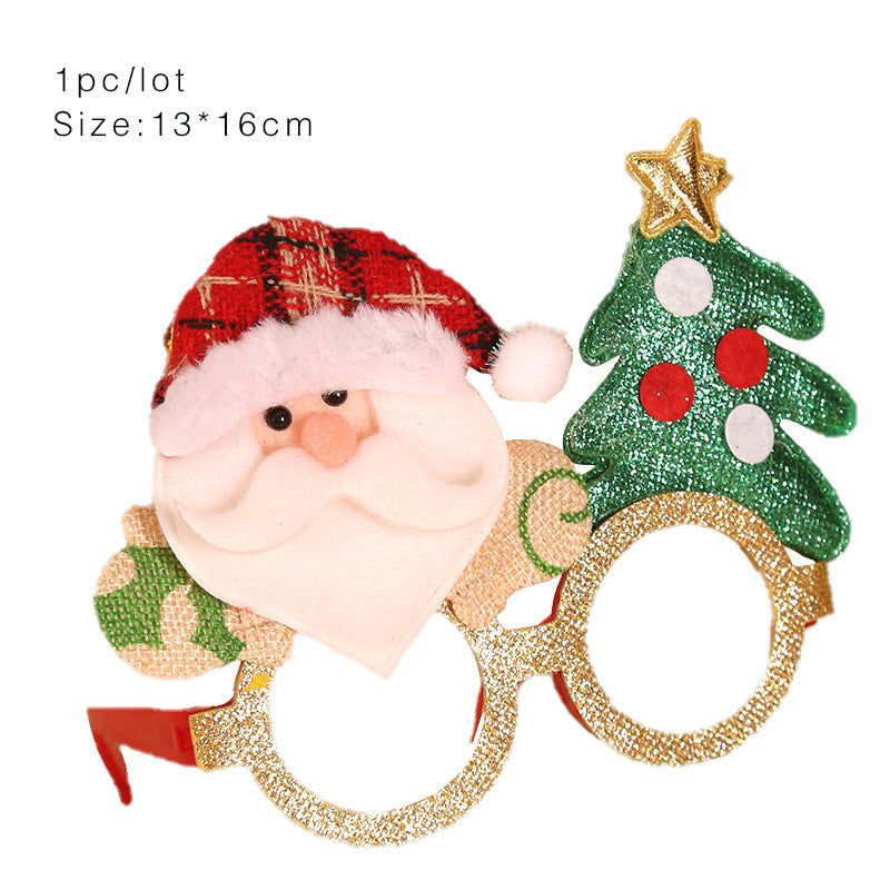 Festive novelty glasses featuring a Santa face with a red hat and a sparkling Christmas tree, adorned with a star and red-green decorations. Size: 13x16 cm. Text reads "1pc/lot".
