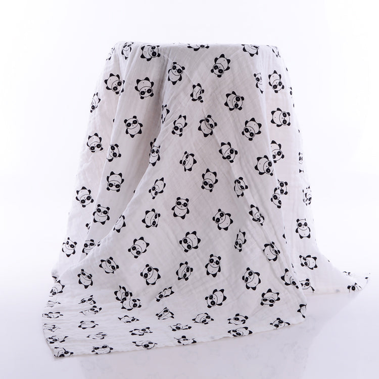 White blanket with small, cute panda faces printed in a repeating pattern. The fabric is draped over an unseen object, creating soft folds and a playful look.