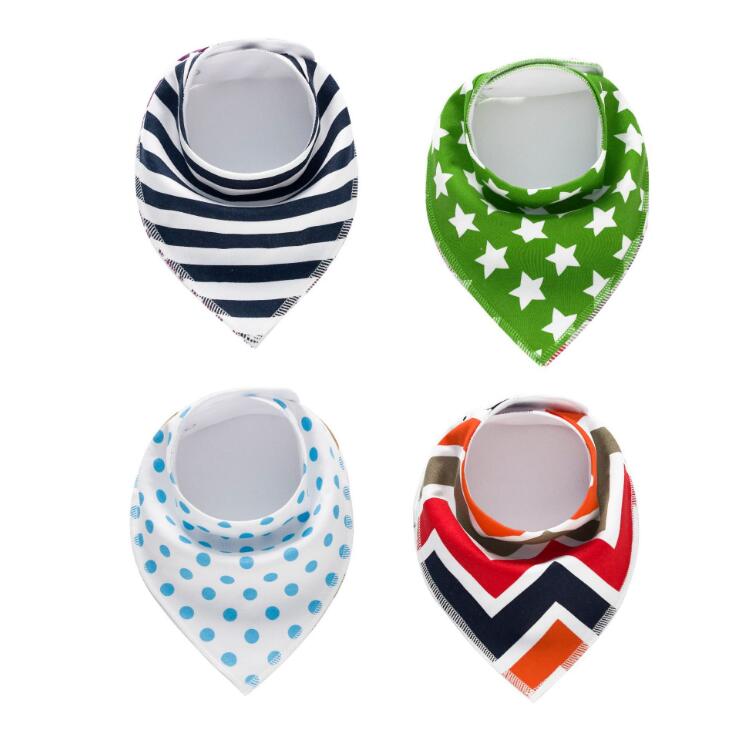 Four baby bibs in different designs: black and white stripes, green with white stars, white with blue dots, and multicolored chevron patterns.