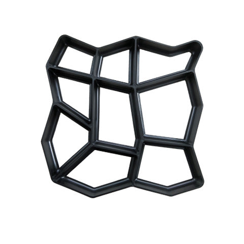 A black, irregularly shaped plastic mold for creating hexagonal and polygonal concrete paving stones, with interconnected compartments of varying sizes and angles.