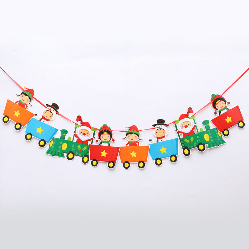 Festive garland with cartoon train cars, each featuring a smiling character in Christmas attire. The train includes Santa, elves, and a snowman on a red string against a white background.