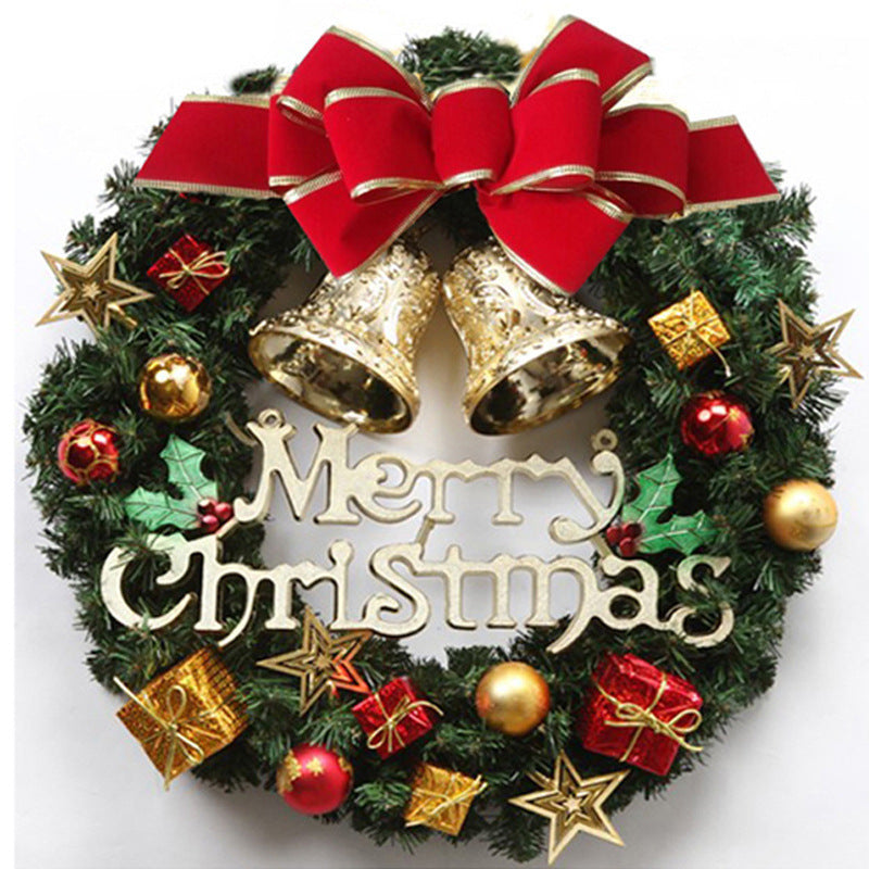 Festive Christmas wreath with gold bells, a red bow, assorted ornaments, and the words "Merry Christmas" in the center. Decor includes gold stars and wrapped gifts.