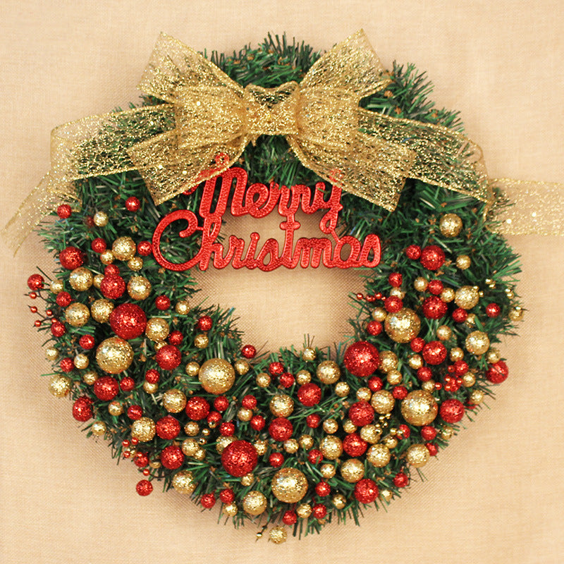 Festive Christmas wreath with red and gold glitter ornaments and a shimmering gold bow. "Merry Christmas" in red script is centered on a backdrop of lush green foliage.