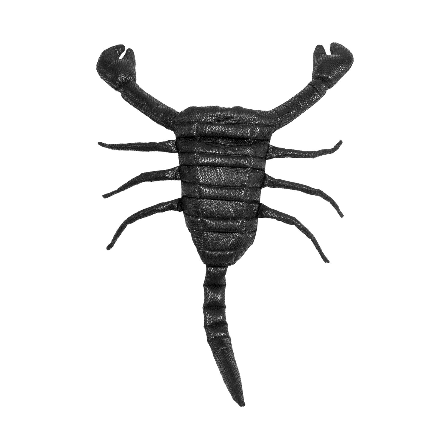A black scorpion toy with detailed texture lies on a white background, showcasing its pincers and curled tail.