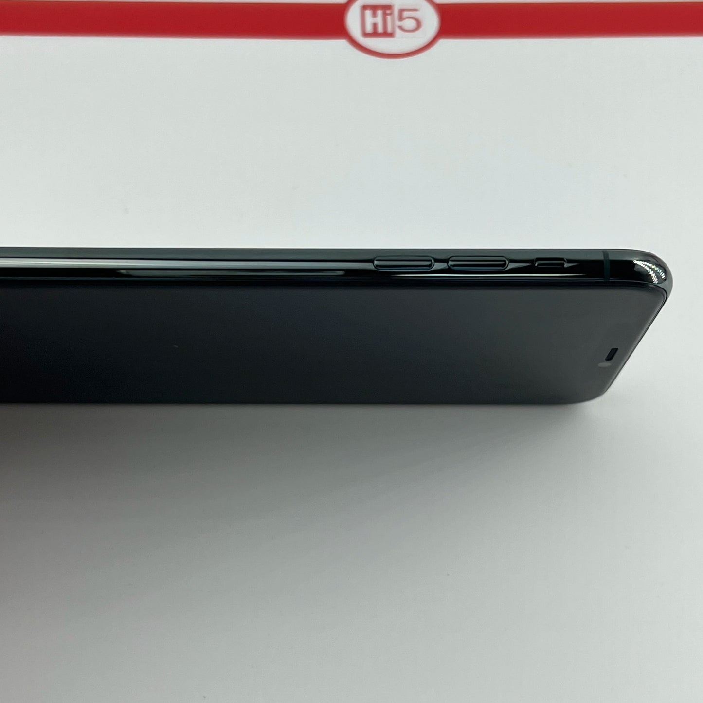 Side view of a black smartphone with three buttons visible on the right side, placed against a white background with a red "Hi5" logo.