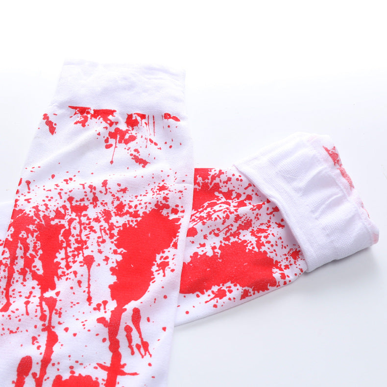 White socks with a red splatter pattern, resembling paint or blood stains. The design is vivid and sporadic, creating a dramatic effect against the white background.