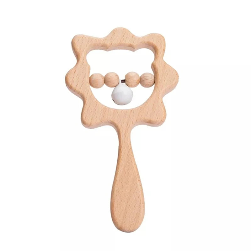 Wooden baby rattle shaped like a flower with a handle, featuring five beads inside, four natural wood and one white, designed for easy gripping and sensory play.