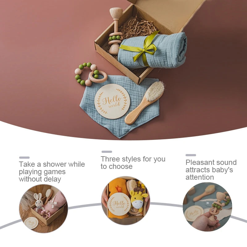 A gift box with a brush, wooden toys, a cloth, and a card reading "Hello world." Text highlights features: play while showering, three style choices, and sounds for babies.