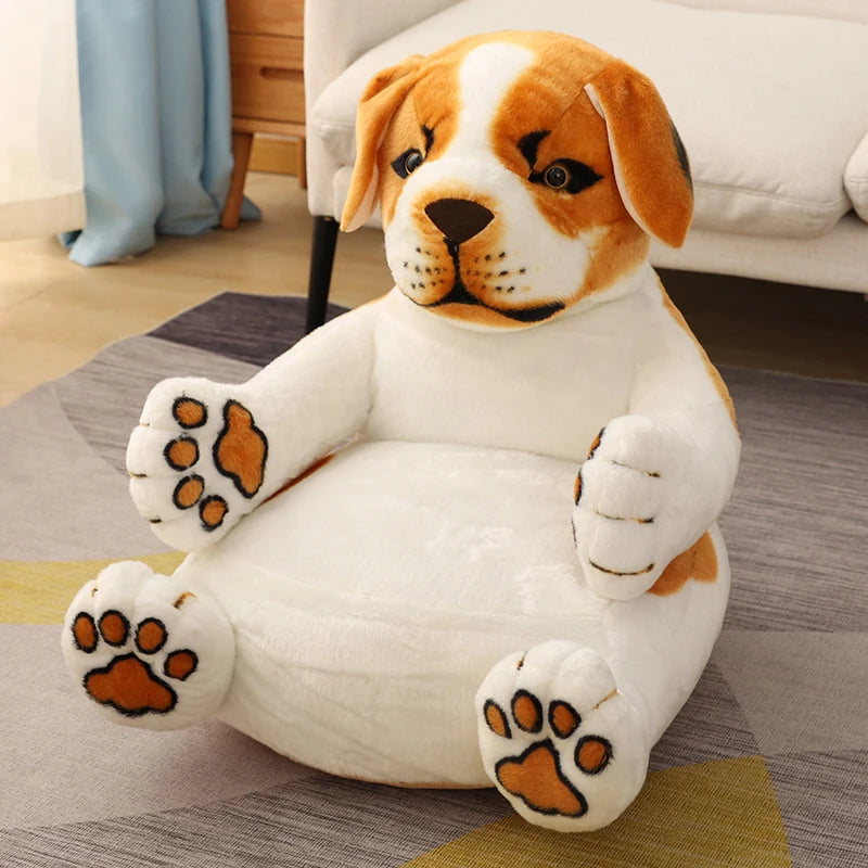 A plush chair shaped like a dog with brown and white fur sits on a rug. The chair has detailed features, including paws and a face, creating a cozy and playful appearance.