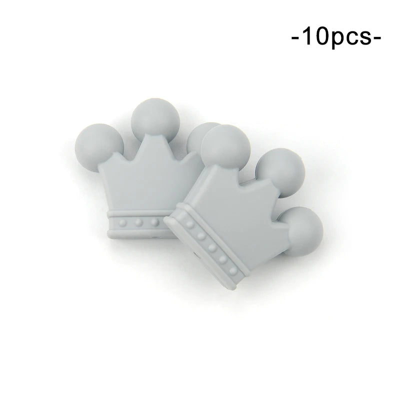Two light gray, rubber crown-shaped pieces with rounded tips and decorative dots are shown. The text "-10pcs-" appears in black at the top right corner.
