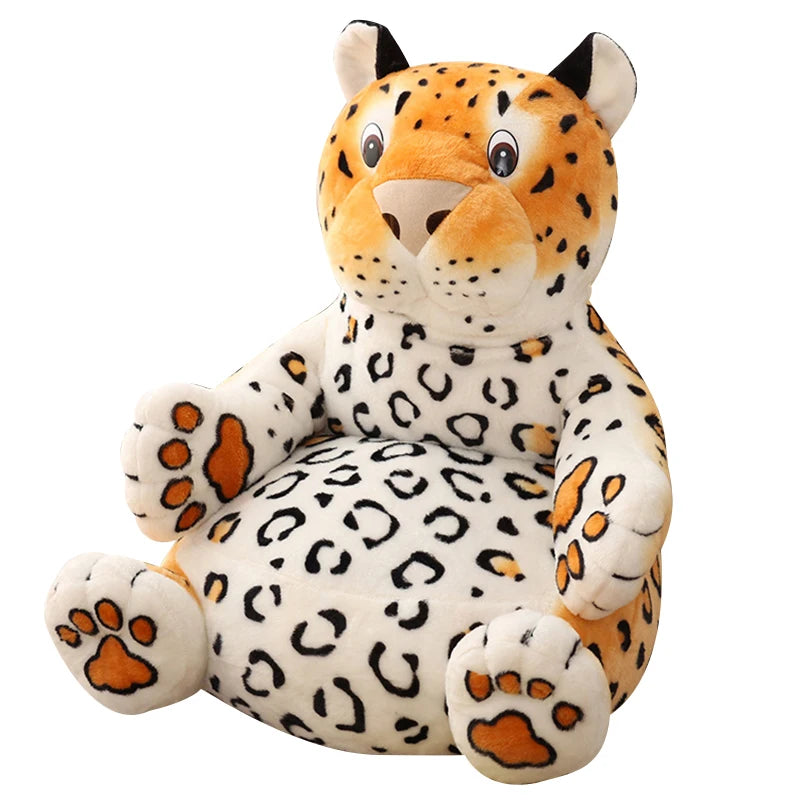 A plush leopard toy chair with a smiling face, orange and black spots, and soft orange paw pads. It has upright ears and a round, welcoming shape.
