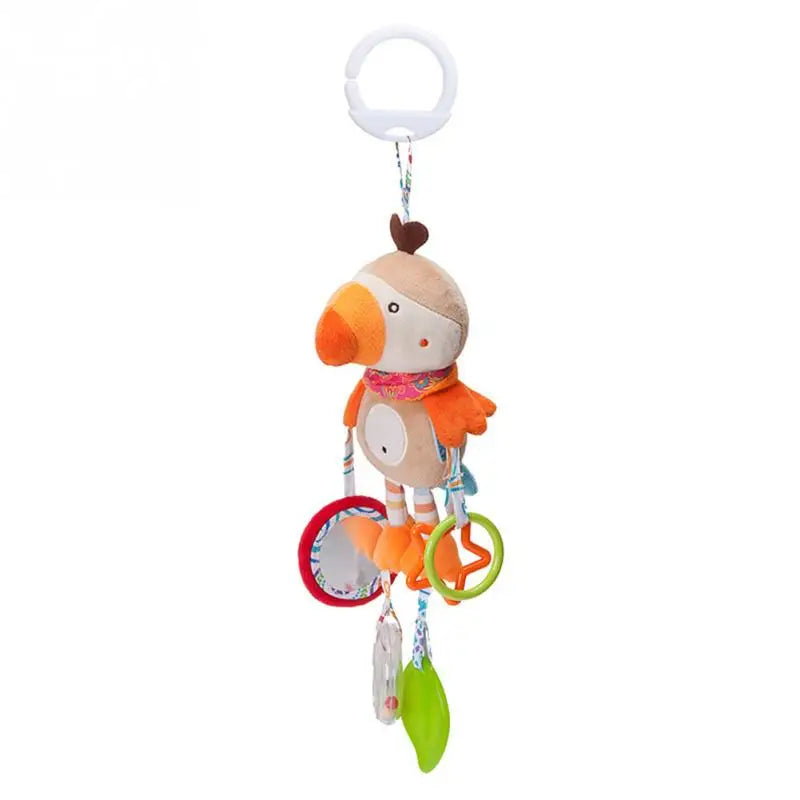 Plush bird toy in orange and beige with a hanging ring on top. It features small colorful rings, a mirror, and textured elements, designed for babies to stimulate sensory exploration.