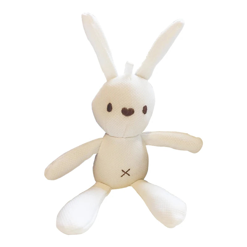 White plush toy rabbit with long ears, small black eyes, and a stitched nose and mouth. It has an X-shaped stitch on its belly. The fabric appears smooth and textured.