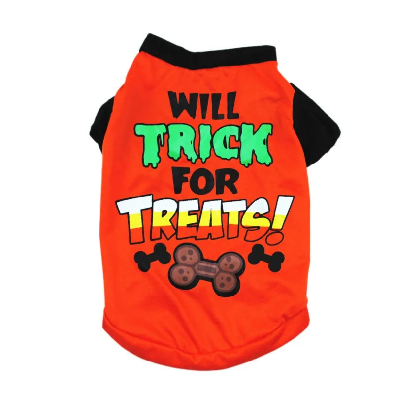 Orange dog shirt with the phrase "Will Trick for Treats!" in bold green, black, and white letters. Features cartoon bone designs and a playful Halloween theme.