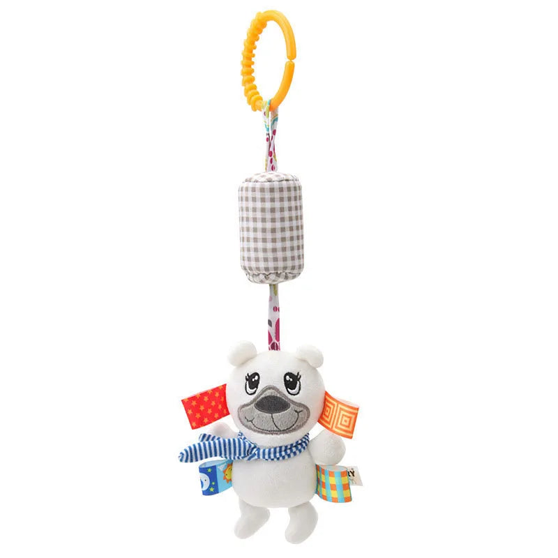 Soft plush toy bear with a blue striped scarf, colorful tags, and a checkered cylinder. It hangs from a plastic yellow ring, featuring a floral strap.