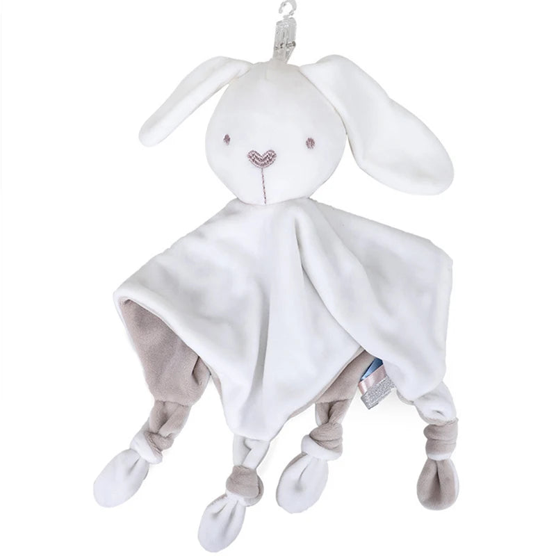 Soft white and gray plush rabbit-shaped baby comforter with floppy ears and knotted corners. It has embroidered facial features and is designed for soothing and tactile comfort.