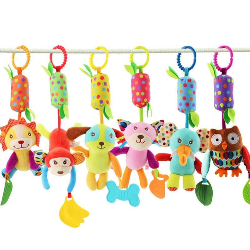 Colorful plush animal toys, including a lion, monkey, dog, cat, elephant, and owl, hang from a line with polka-dot tops and green leaves. Each holds a different accessory.