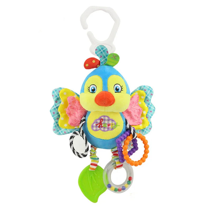 Colorful plush bird toy with crinkly wings, patterned rings, and a green leaf teether, hanging from a white plastic clip. The bird has a cheerful expression and embroidered "happy."