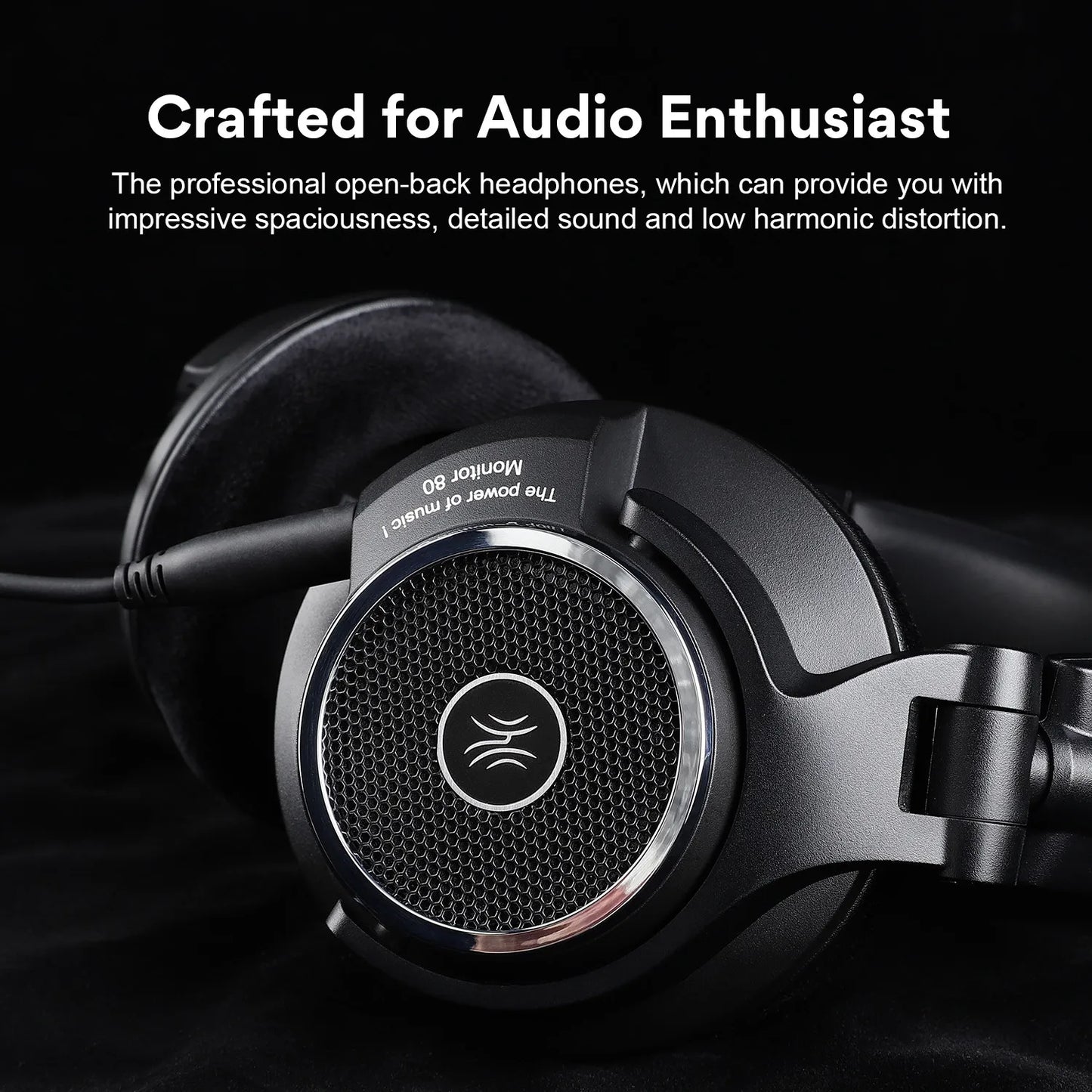 Close-up of sleek black open-back headphones with a silver trim and mesh design. Text above reads "Crafted for Audio Enthusiasts" describing detailed sound and low distortion.
