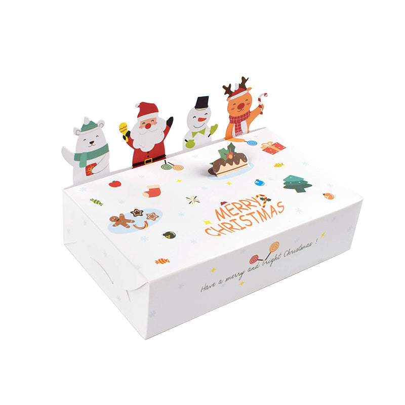 White Christmas box with festive illustrations, including Santa, a snowman, reindeer, and a bear. "Merry Christmas" text and holiday motifs decorate the lid.