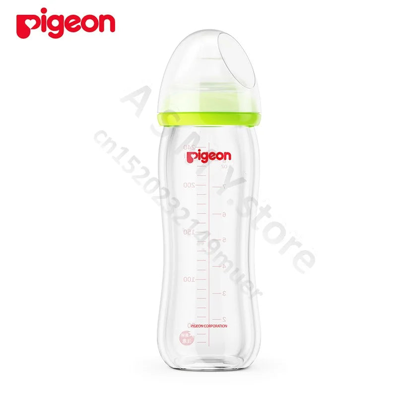 Clear plastic baby bottle with a green ring and domed cap, marked with volume measurements. Red "Pigeon" logo on bottle. White background with watermark text overlay.