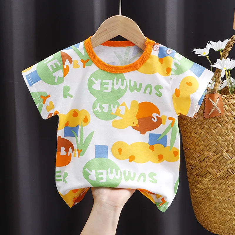 Colorful baby romper with orange trim, featuring playful patterns of ducks, bunnies, and the words "summer" and "baby" in green, yellow, and blue on white fabric.
