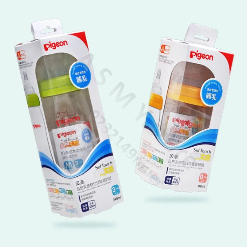 Two boxed Pigeon baby bottles with soft touch silicone nipples are displayed. The left box has a green accent, and the right has an orange accent, showing different nipple sizes.