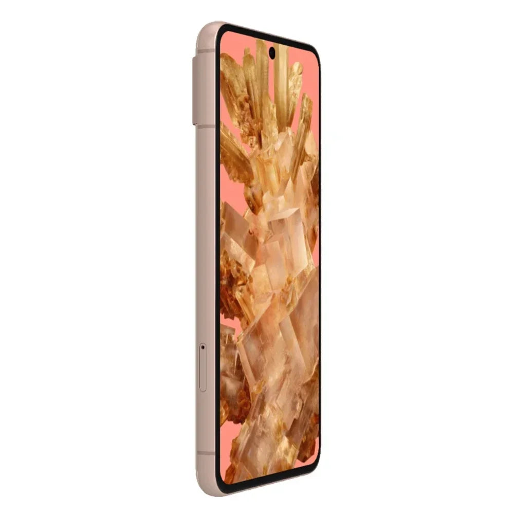 Thin smartphone with copper-colored edges, featuring a full-screen display showing an abstract image of golden crystals against a pink background. Side view angle.