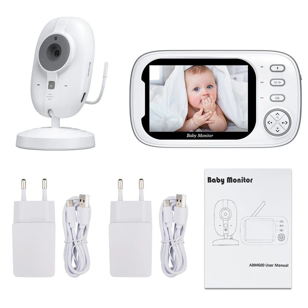 Baby monitor system with a camera and a display showing a baby under a blanket. Includes two USB power adapters, charging cables, and a user manual labeled ABM600.