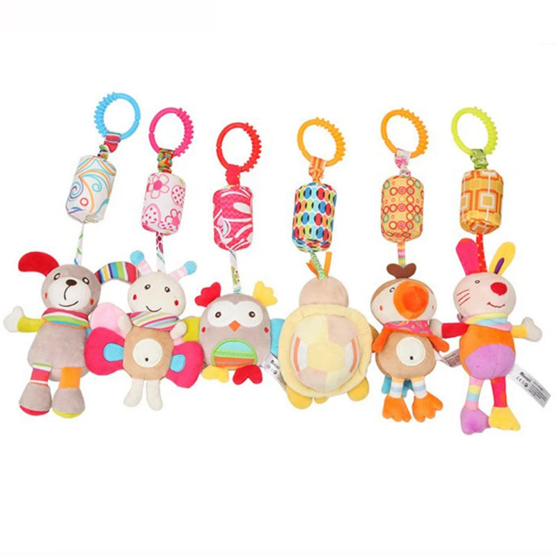 Colorful plush animal toys with attachment rings. Includes a dog, butterfly, owl, turtle, and rabbit. Each has a patterned, cylindrical top with a plastic loop for hanging.