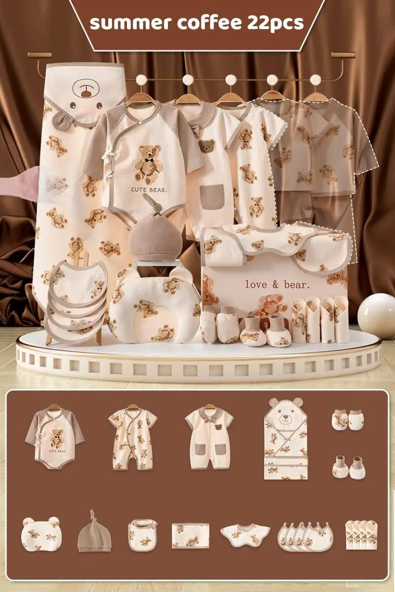 Baby clothing set with bear designs in beige and brown. Includes onesies, bibs, booties, and a blanket displayed on a fabric background. Text reads "summer coffee 22pcs."