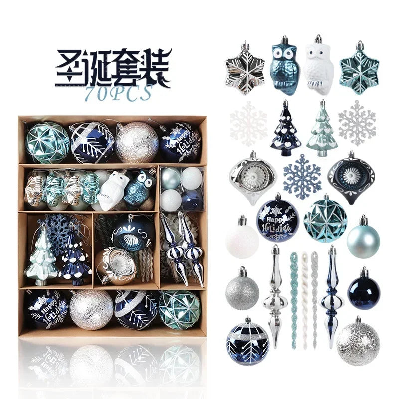 Box of 70 blue, silver, and white Christmas ornaments including baubles, snowflakes, owls, trees, and stars displayed in a grid and scattered arrangement.