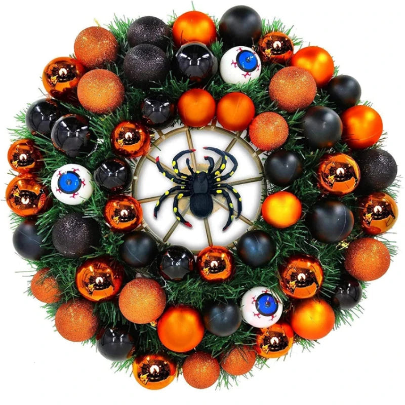 Festive Halloween wreath with orange, black, and eyeball ornaments, featuring a central spider design on a web, surrounded by green foliage.