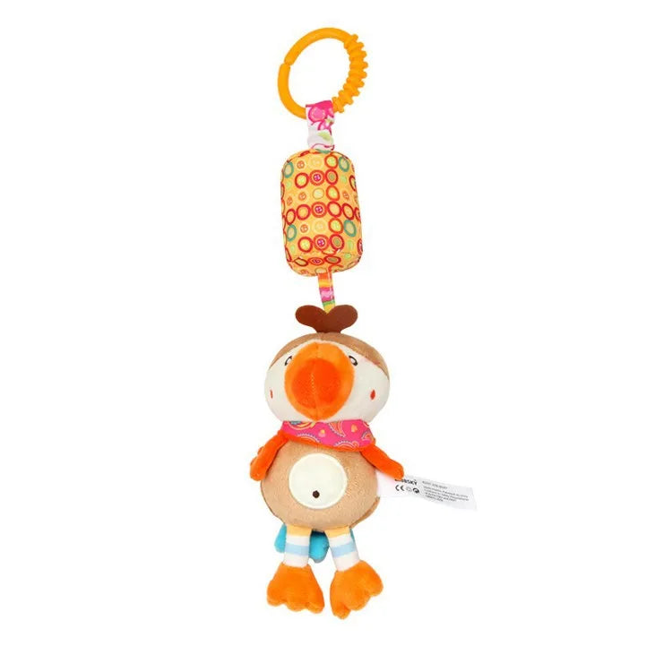 Colorful plush bird toy with an orange clip, patterned fabric, and dangling legs. The bird wears a pink scarf and has a round belly with a small mirror.