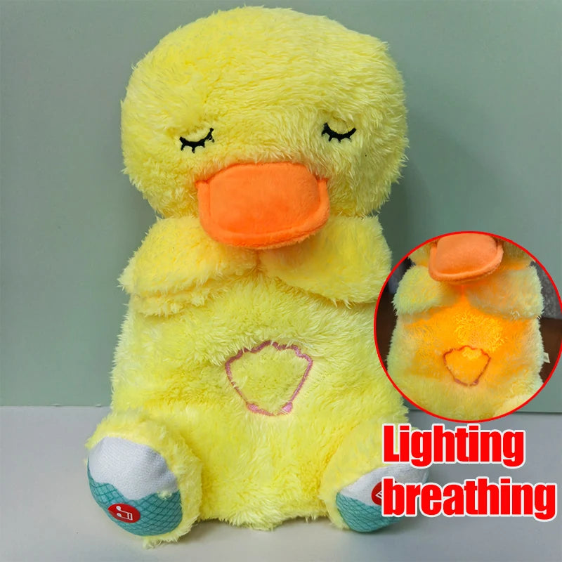Yellow plush duck with closed eyes and orange beak. Heart-shaped light on its belly, shown lit in the inset. Text reads "Lighting breathing" in red.