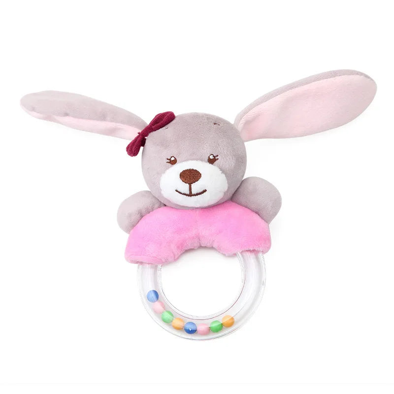 Soft plush bunny rattle with large pink ears, a red bow, pink body, and a clear ring with colorful beads inside. Ideal for infants' tactile and auditory stimulation.