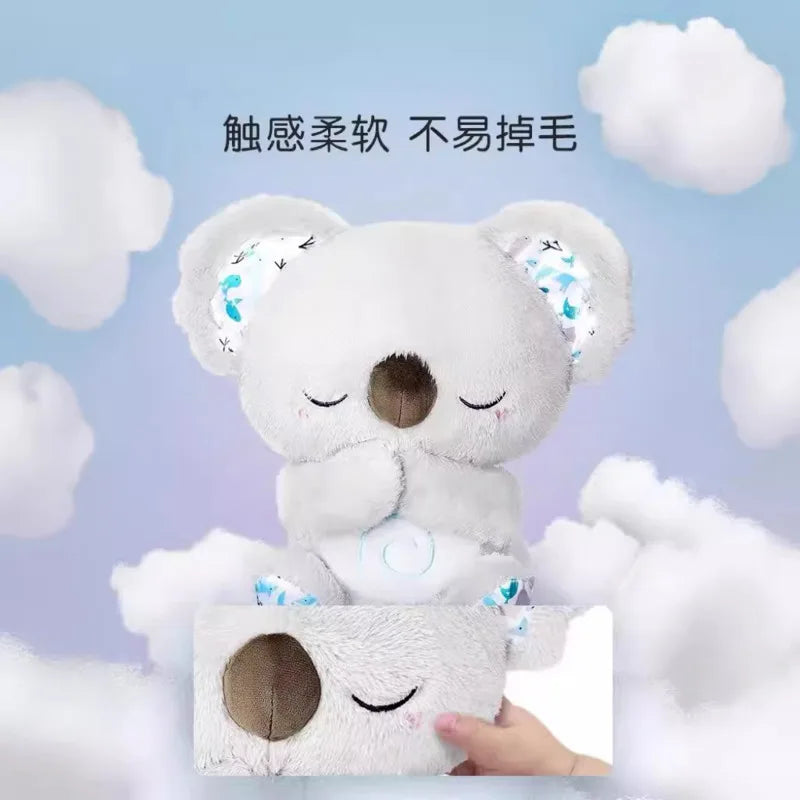 A soft, plush koala toy with closed eyes, set against a cloud-filled background. Text above reads: "触感柔软 不易掉毛," suggesting a gentle, non-shedding texture.