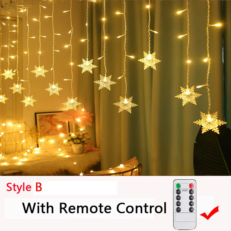 Hanging star-shaped string lights illuminate a cozy room, with a remote control feature. The soft glow highlights decor like flowers and framed art on a table.