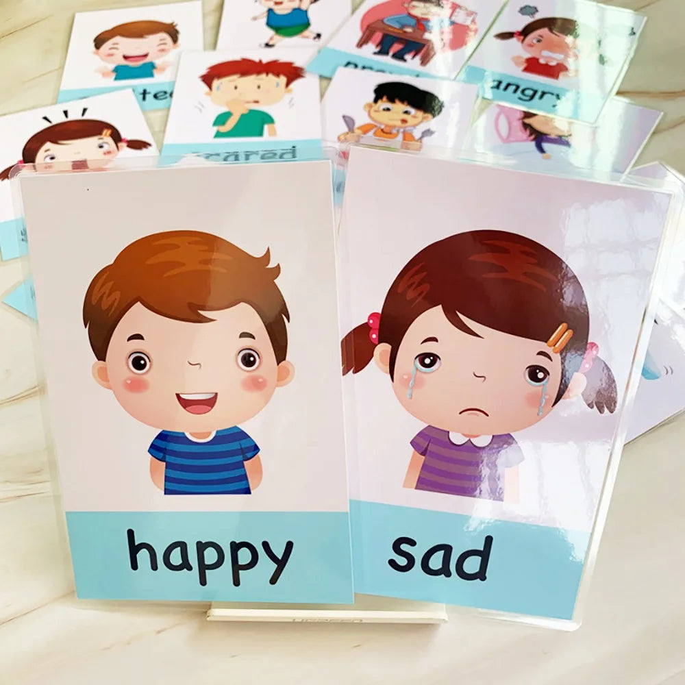 Illustrated emotion flashcards showing a happy boy and a sad girl in the foreground, with additional emotion cards like scared and angry in the background.
