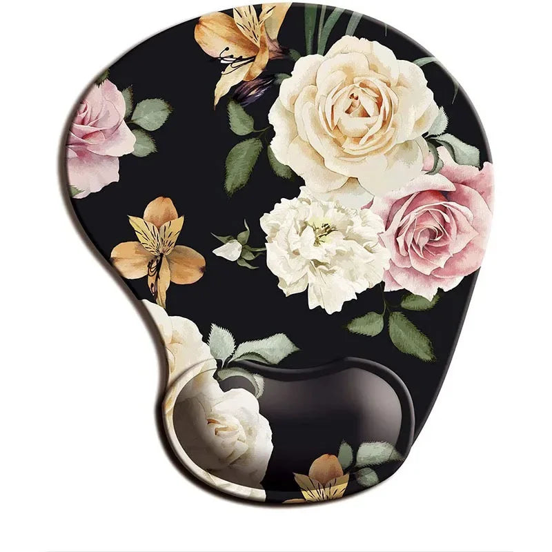 Floral mouse pad with a black background, featuring roses and lilies in shades of white, pink, and orange. Ergonomic design with wrist support.