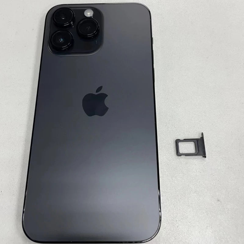 A black smartphone with triple rear cameras and an Apple logo lies on a white surface. Next to it is a removed SIM card tray.