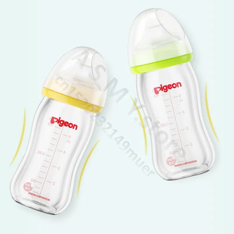 Two transparent baby bottles with wavy shapes, featuring yellow and green caps. Red measurement markings and brand name are printed on the bottles against a light blue background.