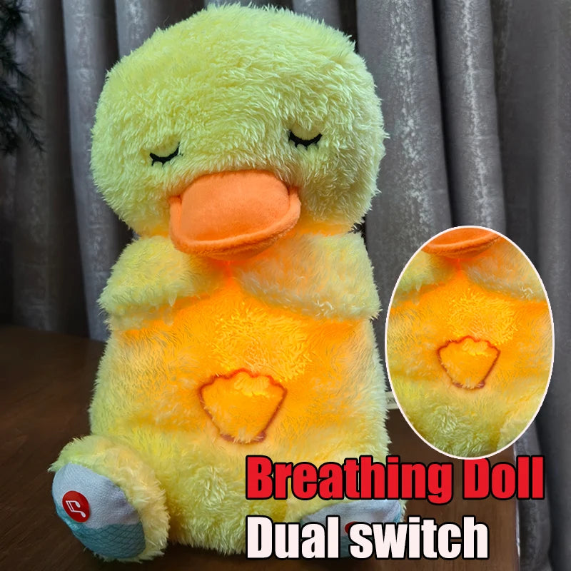 Yellow plush duck with closed eyes and orange beak, illuminated from inside with a glowing light. Text reads "Breathing Doll Dual switch" in bottom right corner.