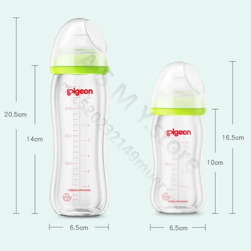 Two transparent baby bottles with green accents from "pigeon" brand. The taller bottle is 20.5cm with a 14cm measurement scale. The shorter bottle is 16.5cm with a 10cm scale.