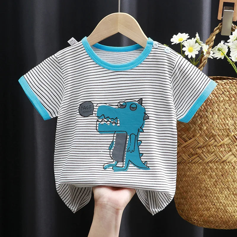 Striped baby t-shirt with a blue cartoon dinosaur design, featuring turquoise trim on sleeves and collar, and a small speech bubble saying "Fact la mouf," hanging on a wooden hanger.